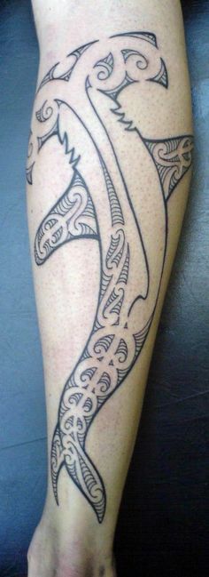 a tattoo on the leg of a person with an intricate design in black and white