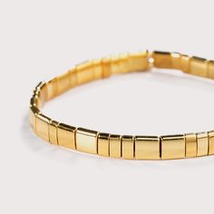 Affordable Luxury Elegant Hypoallergenic Gold Stretch Bracelet, Classic Gold Stretch Bangle Bracelet, Classic Gold Bangle Stretch Bracelet, Elegant Flexible Gold Stretch Bracelet, Elegant Gold Flexible Stretch Bracelet, Gold Stretch Bangle With Letter Beads, Gold Stretch Bangle Bracelet With Letter Beads, Minimalist Yellow Gold Stretch Bracelet, Elegant Adjustable Gold Stretch Bracelet