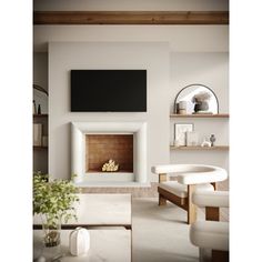 a living room with white furniture and a flat screen tv mounted above the fire place