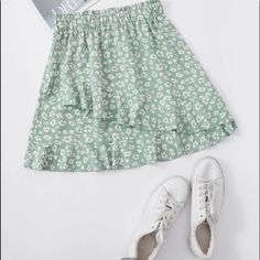 A Cute Short Floral Skirt. High Waisted And Flowing. Mint Green And White. Never Worn. Casual Green Tiered Mini Skirt, Green Bottoms With Ruffle Hem, Green Skirted Bottoms With Ruffle Hem, Casual Green Ruffled Skirt, Green Casual Skirt With Ruffles, Casual Green Skirt With Ruffles, Green Ruffled Skirt For Day Out, Green Ruffled Skort For Spring, Spring Green Skort With Ruffles