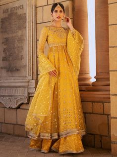 Safeeneh Anarkali Chanderi Sharara With Dabka Work, Yellow Chanderi Palazzo Set With Zari Work, Yellow Unstitched Chanderi Palazzo Set, Eid Anarkali Sharara With Sheer Dupatta, Wedding Palazzo Set In Yellow Chanderi, Wedding Yellow Chanderi Palazzo Set, Yellow Anarkali Chanderi Palazzo Set, Yellow Palazzo Set With Dupatta In Traditional Drape, Gold Chanderi Palazzo Set With Sheer Dupatta