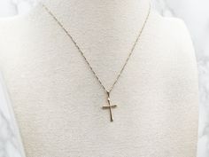 This classic yellow gold pendant is delicate and dainty, perfect for adding a sweet, subtle touch of faith to your look. Whether you choose to accessorize for a special occasion or just to bring a little joy to a regular day, this delightful cross will brighten up any ensemble!This pendant does not come with the chain shown. Don't hesitate to get in touch with us, we will help you find the perfect chain for your style and budget!Metal: 14K Yellow GoldMeasurements: 14 x 26 mm, with bailMarks: "14K USA" Stamped on the reverse Yellow Gold Pendants, Cross Pendant, Gold Pendant, Special Occasion, Yellow Gold, Chain, Pendant, Gold