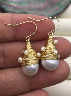 "This pearl is genuine freshwater pearl, 100% real pearl pearl luster: high+ metal: alloy plated 14k solid gold(it's high quality) pearl color: white,please look at picture Back to Other Jewelry Section 01: \"Flameball Pearl\" Section： https://www.etsy.com/shop/WenPearls?section_id=22535705 02: \"Edison Pearl\" Section: https://www.etsy.com/shop/WenPearls?section_id=18890242 03: \"Keshi Pearl\" Section: https://www.etsy.com/shop/WenPearls?section_id=22535725 04: \"Various Baroque Pearl\" Section Elegant Gold Pearl Earrings Wire Wrapped, Elegant Gold Wire Wrapped Pearl Earrings, White Gold Plated Dangle Pearl Earrings, White Gold-plated Dangle Pearl Earrings, White Gold Plated Pearl Earrings For Party, White Akoya Pearl Drop Earrings, Gold Akoya Pearl Hypoallergenic Earrings, White Drop Earrings Gold Plated, White Drop Gold Plated Earrings