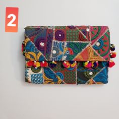 Beautiful clutch bag with vibrant colors , hand embroidery rajaathani culture bag from india  It has one secret pocket inside and zip closure . Its different color variations and style wil go with any dress color and will surely make eyes turn. Width- 17inch  Height 12 inch approximately Bohemian Multicolor Clutch Pouch, Embroidered Rectangular Clutch For Festivals, Multicolor Handwork Rectangular Potli Bag, Multicolor Shoulder Bag With Dori Work For Festivals, Festive Multicolor Shoulder Bag With Dori Work, Bohemian Embroidered Rectangular Clutch, Bohemian Embroidered Clutch For Festive Occasions, Bohemian Multicolor Rectangular Clutch, Festive Multicolor Rectangular Potli Bag