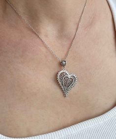 Introducing our Handcrafted Filigree Art Asymmetric Heart Figured Women's Silver Pendant Necklace! This stunning piece features a unique design with an asymmetric heart-shaped pendant, measuring 1.65 inches in height and 1.05 inches in width, suspended from a 20-inch silver chain. Expertly crafted with filigree art, this necklace is a beautiful addition to any jewelry collection. It comes with a silver polish cloth and a luxurious gift box, making it the perfect gift option for Mother's Day, ann Elegant Nickel-free Necklace For Valentine's Day, Unique Heart Charm Pendant Jewelry, Nickel Free Heart Cut Jewelry For Valentine's Day, Nickel-free Heart-shaped Jewelry For Anniversary, Nickel-free Heart Pendant Jewelry For Valentine's Day, Heart Pendant Jewelry For Valentine's Day, Silver Heart Charm Jewelry, Silver Heart-shaped Jewelry With Heart Charm, Silver Heart Pendant Necklace With Heart Beads