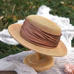 Add a touch of classic charm to your summer wardrobe with these elegant straw boater hats. Crafted from high-quality natural straw, these hats feature a wide brim that provides excellent sun protection while maintaining a stylish look. The hats are adorned with a soft, ruched fabric band in sophisticated colors, including a gentle sage green and a vibrant mustard yellow, allowing you to choose a hue that complements your outfit. Key Features: Made from high-quality natural straw Wide brim for op Adjustable Flat Brim Boater Hat For Picnic, Adjustable Straw Boater Hat For Picnic, Adjustable Straw Boater Hat For Picnics, Spring Wide Brim Paper Straw Boater Hat, Spring Wide Brim Boater Hat In Paper Straw, Straw Flat Brim Boater Hat For Picnic, Flat Brim Straw Boater Hat For Picnic, Straw Boater Hat With Flat Brim For Picnic, Straw Boater Hat With Flat Brim For Picnics