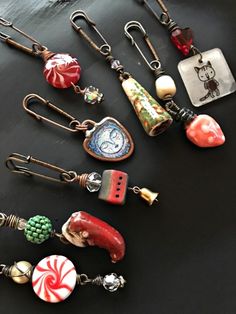 many different types of earrings on a table