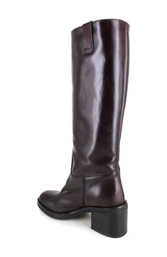 A block heel adds just the right amount of lift to this suave and streamlined knee-high boot. 2" heel 19" shaft; 12" calf circumference Leather upper, lining and sole Made in Italy Retro Knee High Boots, Maroon Knee High Boots, Classic Knee-high Heeled Boots With Leather Lining, Classic Knee-high Boots With Reinforced Heel, Classic Knee-high Boots For Business, Classic Wide Calf Knee-high Boots For Riding, Classic Calf Leather Knee-high Boots For Business, Classic Leather-lined Knee-high Boots For Formal Occasions, Classic Medium Width Knee-high Boots For Business