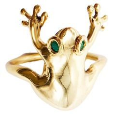 Rossella Ugolini 18k yellow gold and emeralds ring, handcrafted in Italy. This unique ring takes the form of a frog, meticulously designed and adorned with captivating emerald eyes. The frog, crafted in 18k yellow gold, elegantly wraps around the finger, with its front legs extended forward as if holding on. This 18k yellow gold and emeralds ring is a playful, comfortable, and unique unisex accessory that is sure to catch everyone's attention. The frog, in many cultures, symbolizes transformatio Frog Ring, Sapphire Eyes, Emerald Eyes, Unisex Earrings, Whimsical Jewelry, Minimal Ring, Modern Engagement Rings, Diamond Eyes, A Frog