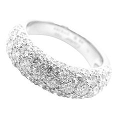 a white gold and diamond ring on a white background with the word love written in it