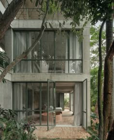 a house that is surrounded by trees and plants