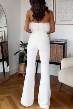 This Meridress strapless jumpsuit features a feather tube top and flare bottoms, perfect for an unforgettable night out. The stylish combination is sure to turn heads and make you the envy of any event! So, get ready to strut with confidence in this jaw-dropping jumpsuit! Material:_Cotton+Polyester SIZE US/CAN BUST WAIST HIPS S 2-4 33"-34" 26"-27" 36"-37" M 6-8 35"-36" 28"-29" 38"-39" L 10-12 37"-39" 30"-32" 40"-42" XL 12-14 40"-42" 33"-35" 43"-45" Chic Bandeau Bottoms For Date Night, Chic Strapless Jumpsuits And Rompers For Party Season, Glamorous Strapless Jumpsuits And Rompers For Date Night, Elegant Bandeau Jumpsuits And Rompers For Party, Chic Feather Trim Bottoms For Night Out, Chic Strapless Jumpsuit For Night Out, Chic Feathered Bottoms For Summer, Elegant Party Bottoms With Feather Trim, Chic Bandeau Jumpsuits And Rompers For Party