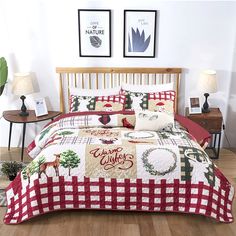 a red and white comforter with christmas decorations on it