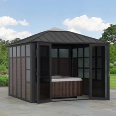 a gazebo with a hot tub inside of it