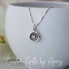 Always & Forever - this petite .925 sterling silver necklace makes a great Valentine's Day gift, bridal necklace, gift for mother/daughter, or a special someone in your life. This tiny wax seal heart dangles from an Italian made box or rolo chain. It is lightweight and prefect for everyday wear. Necklace comes ready for gifting in a jewelry box. Crafted out of recycled .925 sterling silver both the charm and chain are nickel-free. Dimensions:  Heart charm: 13mm long x 10mm wide Matching earrings Tiny Sterling Silver Heart Pendant, Heart-shaped Sterling Silver Charm Necklace, Tiny Heart-shaped Sterling Silver Charm Necklaces, Adjustable Heart-shaped Sterling Silver Charm Necklace, Nickel-free Heart Sterling Silver Charm Necklace, Always Forever, Heart Charm Necklace, Gift For Mother, Tiny Heart