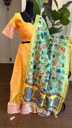 Pure Mangalagiri Silk Cotton Lehenga with pen kalamkari silk cotton Dupatta. Silk Cotton Lehenga with zari borders. Lined skirts and blouse , double lined. Color : yEllow with pink silver zari  Blouse size :36 goes upto 39 Skirts - 36-40. Duppatta: pen kalamkari hand painted  silk dupatta Designer Chanderi Lehenga With Kalamkari Print, Unstitched Lehenga With Kalamkari Print, Traditional Kalamkari Print Lehenga For Designer Wear, Anarkali Chanderi Choli With Kalamkari Print, Designer Wear Lehenga With Kalamkari Print For Festivals, Transitional Anarkali Choli With Kalamkari Print, Traditional Yellow Block Print Sets, Traditional Multicolor Cotton Silk Lehenga, Unstitched Art Silk Choli With Kalamkari Print