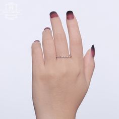 a woman's hand with a ring on it