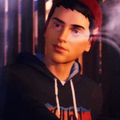 a young man wearing a red hat and black sweatshirt