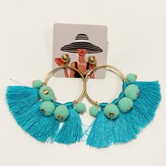 Gold Hoop Tassel/Pom Poms Earrings Hoop Tassel Earrings Featuring Small Pom Poms. Measurements: 1.5 X 3.0" Approx. Turquoise Tassel Earrings For Beach, Blue Tassel Dangle Earrings For Summer, Trendy Blue Hoop Earrings For Spring, Blue Summer Tassel Dangle Earrings, Blue Hoop Earrings For Summer Festivals, Blue Hoop Earrings For Spring, Turquoise Tassel Drop Earrings For Summer, Summer Turquoise Tassel Drop Earrings, Summer Beach Turquoise Tassel Earrings