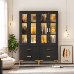 a black cabinet with glass doors in a living room next to a white couch and potted plant