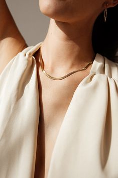 Centauri's Herringbone Snake Chain Necklace is a must-have for everyday wear. Its herringbone chain gives it a unique look that's still subtle enough for any occasion. It's also water resistant and tarnish resistant, making it a reliable accessory. Enjoy a stylish look that won't let you down. MATERIAL: 18k Gold plated, Stainless steel SIZE: 16" or 18" (Available in silver - Check out our Silver Collection!) Water resistant, tarnish resistant, hypoallergenic, & nickel/lead free. Tarnish Resistant Herringbone Necklace For Formal Occasions, Minimalist Everyday Herringbone Chain Necklace, Classic Everyday Snake Chain Necklace With Clavicle Chain, Dainty Herringbone Necklace With Gold Chain For Everyday, Everyday Dainty Herringbone Necklace With Gold Chain, Dainty Gold Chain Herringbone Necklace For Everyday, Dainty Herringbone Necklace With Adjustable Chain For Everyday, Classic Herringbone Necklace With Clavicle Chain For Everyday, Everyday Gold Snake Chain Necklace