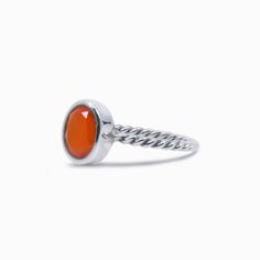 With its brilliant orange and red-orange color, this sun-kissed-looking gem will add a burst of color and creativity to your everyday wear. This translucent stone will stimulate its wearer's analytical capabilities and precision. It protects against envy, fear, and rage, and will banish any sorrows and brings an energy of love. This Carnelian ring cleanses negativity and provides perceptiveness, awakening one's inherent talents, abilities, physical energy, personal power, and compassion. Stone O Red Carnelian Rings With Polished Finish, Red Carnelian Ring With Polished Finish, Red Polished Carnelian Rings, Orange Carnelian Ring Jewelry, Orange Carnelian Jewelry For Anniversary, Orange Cabochon Jewelry For Anniversary, Modern Orange Gemstone Rings, Modern Orange Oval Jewelry, Adjustable Orange Cabochon Jewelry