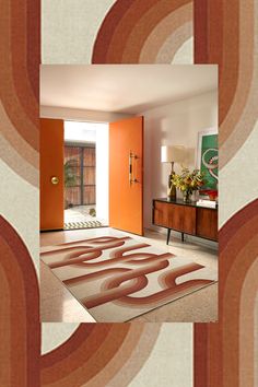 a living room with an orange door and rugs on the floor in front of it