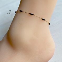 "Beaded ankle bracelet in three styles. Dainty chain with tiny beads. Gold plated brass chain. Chain length: 8.5\" Extension: 1.75\"" Adjustable Beaded Chain Anklet As Gift, Summer Gift Beaded Chain Anklets, Elegant Summer Anklets With Round Beads, Summer Gift Anklets With Gold Beads, Beaded Bracelet Anklet As Gift, Minimalist Anklet With Satellite Chain As Gift, Minimalist Satellite Chain Anklet As Gift, Dainty Beaded Chain Anklets With Round Beads, Gold Beaded Anklet As Gift