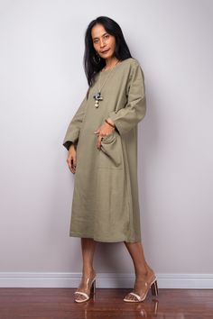 "Green long sleeve midi dress with pocket | Loose fit cotton dress with split PRODUCT SIZE : Free Size * Chest : up to 40\" * Armhole : 20\" * Sleeve length : 19\" * Shoulder to shoulder : 17\" * Waist : free up to 40\" * Hips : free up to 44\" * Length : 42\" from shoulder to hem (measured when laying flat) MATERIAL * Cotton MODEL : * Model chest : 32\", waist : 24\" hips : 35\" * Combined Height is 5\"6 > I'm 5\"2 (158cm) and I'm wearing 4\" heels in the pictures * Accessories excluded POLI Modest Cotton Maxi Dress For Fall, Cotton Midi Dress With Pockets For Work, Relaxed Fit Midi Dress For Fall, Relaxed Fit Fall Maxi Dress, Long Sleeve Midi Dress With Pockets For Work, Fall Midi Dress With Relaxed Fit, Fall Season Relaxed Fit Maxi Dress, Cotton Midi Dress With Relaxed Fit, Relaxed Fit Long Sleeve Solid Color Midi Dress