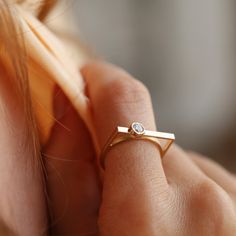 Elevate your style with our stunning collection of handcrafted gold rings on Etsy. From classic round-cut designs to modern geometric shapes, each piece is meticulously crafted to perfection. Our zircon embellished rings add a touch of sparkle, while our minimalist and stackable options offer versatility for everyday wear. Whether you're celebrating an anniversary, birthday, or searching for the perfect Mother's Day gift, our delicate and handmade rings are sure to delight. Available in rose gold, yellow gold, or 14k white gold, each ring is a timeless treasure to cherish. Shop now and discover the beauty of handcrafted jewelry. Minimalist Open Ring With Single Cut Diamonds, Minimalist Rose Gold Rings With Single Cut Diamonds, Modern Adjustable Stackable Diamond Ring, Modern Everyday Rings With Bezel Setting, Modern Adjustable Diamond Promise Ring, Minimalist Open Band Diamond Ring With Single Diamond, Minimalist Single Diamond Open Band Ring, Minimalist White Gold Open Birthstone Ring, Gold Minimalist Ring With Single Cut Diamonds