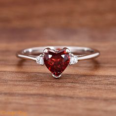 Heart Red Cubic Zirconia Sterling Silver Ring, Simulated January Birthstone Garnet Color CZ Sterling Silver Girls Womens Ring ▷Gift Box Included ▷7mm Height ▷Size 3 - 12 Available ▷925 Sterling Silver (not plated or filled) ▷925 Stamp Authenticity ▷High-Quality Cubic Zirconia Used https://www.etsy.com/shop/TrendyRing Red Cubic Zirconia Birthstone Jewelry, Red Heart-shaped Cubic Zirconia Jewelry, Red Diamond Heart Ring For Anniversary, Red Heart Diamond Ring For Anniversary, Red Heart Shaped Diamond Anniversary Ring, Heart-shaped Diamond Ring For Anniversary, Red Heart-shaped Promise Jewelry, Valentine's Day Red Heart Sterling Silver Ring, Red Cubic Zirconia Promise Ring