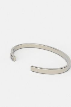 Whether you're looking for a traditional look or something newer, this cuff for men is a timeless piece of jewelry that you can wear for official events and everyday life.When choosing a men's jewel, ensure the style and material match your outfit. Choosing a comfortable men's bracelet is essential in ensuring it fits perfectly.Their exteriors and minimal shape allow the precious metal plating to shine through. You can wear them alone or with other minimal accessories with similar tones. This is the perfect piece to accessorize your wardrobe. Metal: 925 Sterling Silver / 24k Gold Plated / Rhodium over 925 Sterling Silver Dimensions: 6 mm W One Size Fits Most The cuff can open and close, is a malleable metal and carefully can adjust to your wrist. Type: Cuff 100% Handcrafted Package: High q Classic Bracelet Wristband, Modern Cuff Bracelet For Everyday Wear, Modern Cuff Bracelets For Everyday Wear, Modern Everyday Cuff Bracelets, Modern Cuff Jewelry For Everyday, Timeless Adjustable Cuff Jewelry, Timeless Stainless Steel Bracelets For Anniversary, Classic Formal Stainless Steel Cuff Bracelet, Timeless Formal Cuff Bracelet