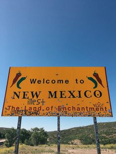 a welcome to new mexico sign in the middle of nowhere