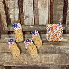 three pieces of cereal sitting on top of a wooden bench