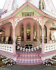 the facebook page is showing an image of a pink house with white trimmings