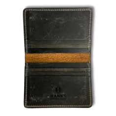 Rugged yet refined, you’ll proudly pull this handsome wallet out of your pocket day after day. Made in the USA from smooth, durable goatskin, these slim wallets will keep your cash and cards safe without added bulk. The Hanks Slimline card case holds everything you need while maintaining a slim profile that can slide easily in a front pocket. Bison Leather outer and Steerhide interior. As the leather ages, the patina develops its own unique characteristics. Dimensions Closed ~4 ½" X 3 1/8" | Ope Bison Leather, Leather Bifold Wallet, Slim Wallet, Card Case, Front Pocket, Leather Wallet, Patina, Wallets, Made In The Usa