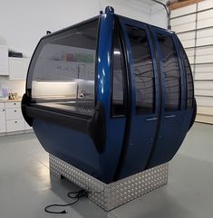 a large blue object sitting in a garage