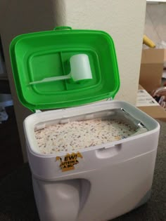 a green and white cooler sitting on top of a table