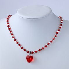 Handmade heart bright red glass bead and silver plated seed bead necklace. This dainty statement necklace is understated gorgeous, something truly lovely you could wear everyday to add a little extra sparkle to your day.  The faceted glass heart catches the light to add that lovely sparkle this necklace will add to any outfit.  Made with  ⭐ 4mm faceted glass rondelle bright red beads ⭐ 4mm silver plated seed beads  ⭐ 14mm faceted bright red heart ⭐ Tibetan silver plated flower patterned pendant Silver Beaded Necklaces With Heart Beads For Gift, Silver Beaded Necklace With Heart Beads For Gift, Silver Beaded Necklace For Valentine's Day Gift, Red Handmade Necklace, Party Red Necklaces With Tiny Beads, Party Beaded Necklace With Heart Pendant, Party Heart Pendant Beaded Necklace, Red Tiny Beads Necklace For Party, Silver Beaded Necklaces For Valentine's Day