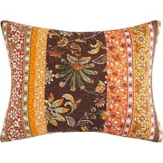 an orange and brown pillow with multicolored stripes