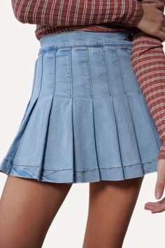 Denim mini skirt featuring pleats all round, one button on the side of the waist, and an invisible side zip closure. Crafted with slightly stretchy cotton fabric. -High waistline.-Side button and zip closure.-Pleated front and back.-99% Cotton 1% Spandex. Size Guide -The model is wearing a size Small.-The model is 5'8" tall.-Length of size Small is 14"-WAIST S 24-26" M 26-28" L 28-30" Shipping ﻿-Ships from the US within 5-7 days. Denim Tennis Skirt, Uk Fits, Bride Fashion Illustration, Plated Skirt, Bride Fashion, Tennis Skirt, Denim Mini, Jean Skirt, Denim Mini Skirt