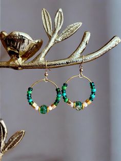 Gorgeous green and gold beaded hoop earrings.  Fish hook ear wire.  Also available in deep purple and browns. Earrings Emerald, Beaded Hoop Earrings, Beaded Hoops, Jade Green, Perfect Gift For Her, Fish Hook, Ear Wire, Gold Beads, Deep Purple