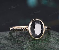 ***This mesmerizing ring features a black onyx gemstone, known for its protective and grounding properties. The deep black hue of the onyx exudes a sense of strength and stability, making this ring a meaningful and elegant addition to any jewelry collection. With its timeless appeal, this black onyx ring becomes a symbol of resilience and inner strength, perfect for those seeking a touch of sophistication and meaningful symbolism in their jewelry.***- Metal: Solid gold(10K/14K/18K white/yellow/r Black Oval Anniversary Ring, Black Oval Rings For Anniversary, Elegant Black Oval Ring, Elegant Black Round Band Jewelry, Luxury Black Round Band Rings, Elegant Black Jewelry Band, Black Oval Promise Ring, Oval Black Promise Ring, Black Round Band Ring Fine Jewelry