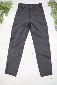 "Strong un and thick leather moto pants in excellent condition. PLEASE CHECK ALL MEASUREMENTS BELLOW: Length: 106 cm / 42\" Waist: 72 cm / 28\" Hips: 102 cm / 40\" Inseam: 77 cm /30\" Fabric: leather, polyester Brand: Frank Thomas Condition: excellent * dry clean only LOOK FOR OTHER COOL VINTAGE CLOTHING HERE: https://www.etsy.com/shop/OnTheRoadStore KEEP IN MIND: Photo might be slightly different from actual item in terms of color due to the lighting during photo shooting or your monitor's disp Black Leather Moto Bottoms, Black Leather Biker Pants, Fitted Moto Leather Pants, Fitted Leather Biker Pants For Motorcycling, Black Biker Leather Pants, Fitted Black Moto Leather Pants, Biker Style Full-length Leather Pants For Biker Events, Black Full-length Leather Pants For Biker Events, Moto Leather Bottoms