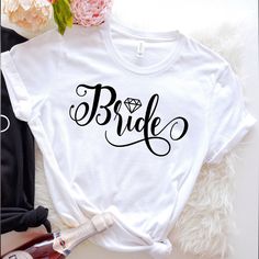 a t - shirt with the word bride written in cursive font on it