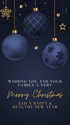 merry christmas and happy new year greeting card with two blue ornaments hanging from the ceiling