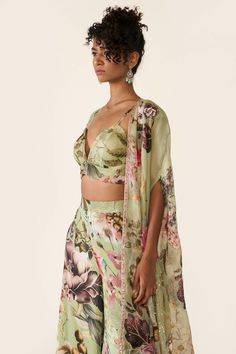 The green printed organza cape features sequin, cutdana and bead highlights with hand threadwork. It is paired with green printed bralette and trousers with thread work. Organza Cape, Varun Bahl, Embroidered Cape, Printed Organza, Palazzo Set, Vacation Style, Thread Work, Green Print, Long A Line