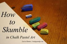 the book how to skimble in chalk pastel art is on a wooden table