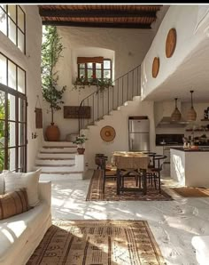 a living room filled with furniture next to a staircase leading up to a second story