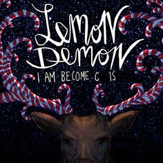 the cover for lemon demon i am become christmas, featuring an image of a deer's head with candy canes on its antlers